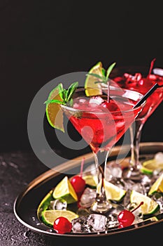 Strawberry daiquiri cocktail with lime, strawberry, cherry and m