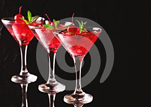 Strawberry daiquiri cocktail with lime, strawberry, cherry and m