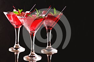 Strawberry daiquiri cocktail with lime, strawberry, cherry and m