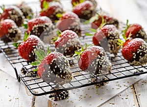 Strawberry dessert, Dark chocolate covered strawberries, fresh strawberries dipped in melted dark chocolate sprinkled with sesame