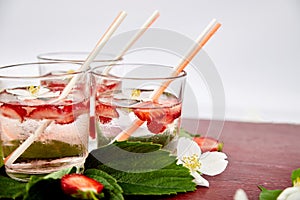 Strawberry detox water with jasmine flower. Summer iced drink