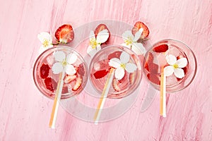 Strawberry detox water with jasmine flower. Summer iced drink or tea