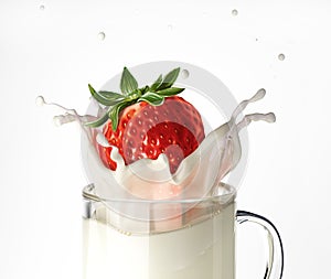 Strawberry falling into a glass mug full of milk, splashing.