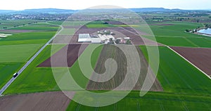 Strawberry field, against the backdrop of a large heat complex. Flight over the agricultural zone