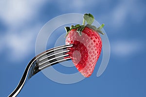 Strawberry on fork