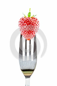 Strawberry on a fork against