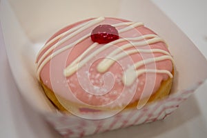 Strawberry frosted jelly donut