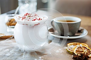 Strawberry granita with prosecco foam. Delicious sweet dessert food closeup served for lunch in modern gourmet cuisine