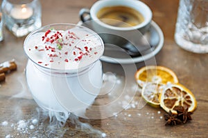 Strawberry granita with prosecco foam. Delicious sweet dessert food closeup served for lunch in modern gourmet cuisine