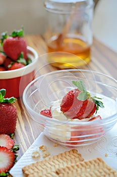 Strawberry with honey and wipped cream