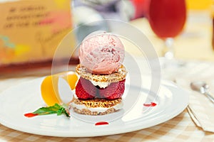 Strawberry ice cream dish with fresh cookie photo