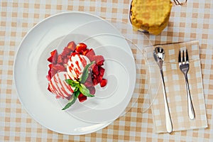 Strawberry ice cream dish with fresh strawberry photo