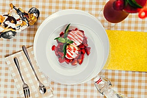 Strawberry ice cream dish with fresh strawberry photo
