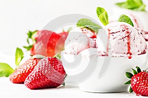 Strawberry ice cream with jam topping, decorated with green mint