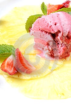 Strawberry ice-cream with pineapples and mint
