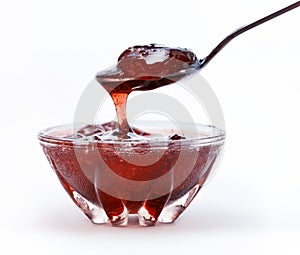 Strawberry jam in glass vase isolated on white background