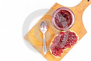 Strawberry jam spread on the bread served