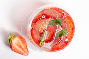 Strawberry juice in a glass isolated