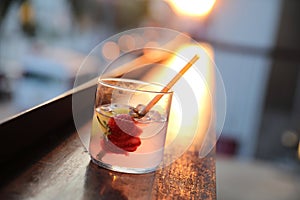 Strawberry juice with soda on wooden table