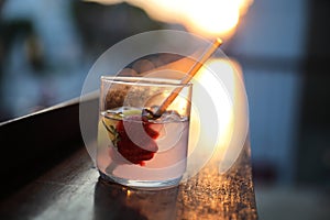 Strawberry juice with soda on wooden table