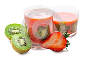 Strawberry juice in two transparent glasses decorated kiwi and strawberry isolated on white background, concept healthy drink