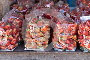 Strawberry juicy fruit in plastic bag