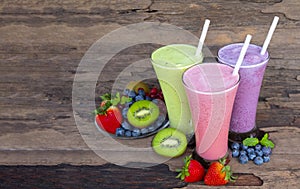 Strawberry kiwi and blueberry  smoothies colorful fruit juice milkshake.