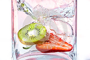 Strawberry and kiwi in water