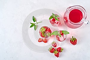 Strawberry lemonade, cocktail with ice and mint in glasses