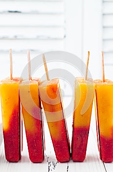 Strawberry mango popsicles - ice pops - paletas. photo