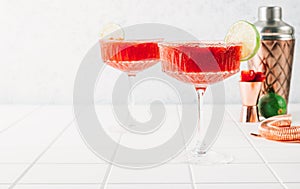 Strawberry Margarita or Daiquiri Cocktail with lime and mint on white background.