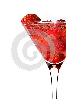 Strawberry in martini glass with champagne