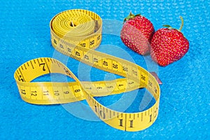 Strawberry with metric tape measure