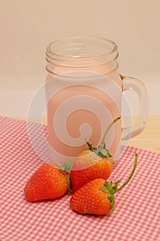 Strawberry and milk strawberry flavor on wood table and space for write wording