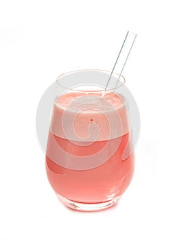 Strawberry milkshake in a glass with glass straw