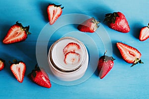 Strawberry milkshake in the glass jar blue vintage background