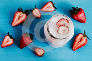 Strawberry milkshake in the glass jar blue vintage background