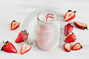 Strawberry milkshake in the glass jar white background