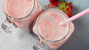 Strawberry milkshake in mason jars