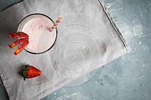 Strawberry milkshake on the rustic background