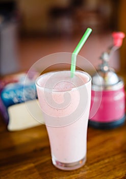 Strawberry milkshake on the table in cafe