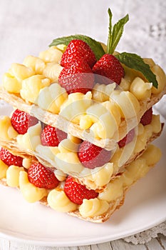 Strawberry millefeuille with cream Patissiere close-up on a plate