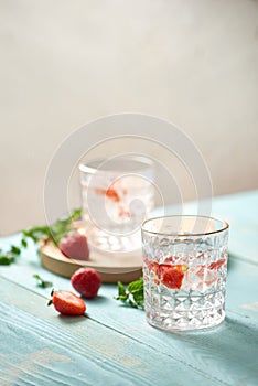 Strawberry mojito cocktail isolated on wooden table