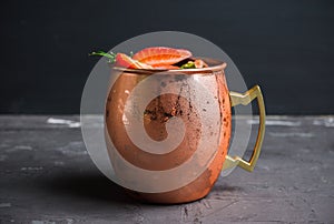 Strawberry moscow mule on thr rustic background