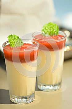 Strawberry mousse and mint leave in glass