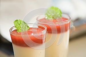 Strawberry mousse and mint leave in glass