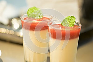 Strawberry mousse and mint leave in glass