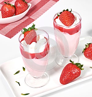 Strawberry mousse with strawberry syrup decorated with fruit photo