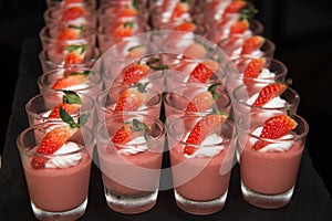 Strawberry panacotta cream dessert on the table photo