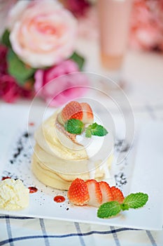 Strawberry pancake or Ichigo souffle pancakes with soft focus on the top souffle photo